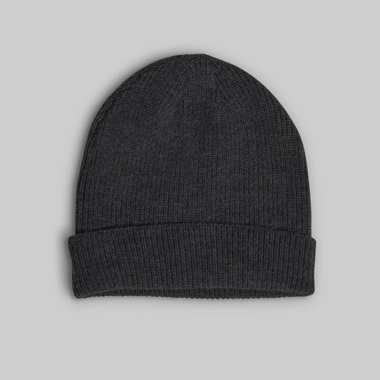 A dark charcoal gray ribbed knit beanie hat with a folded cuff, shown flat against a solid light gray background.