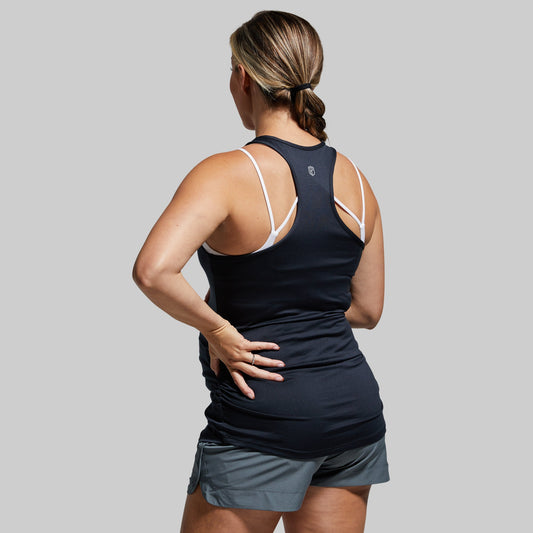 Pregnant woman wearing black racerback maternity tank top.