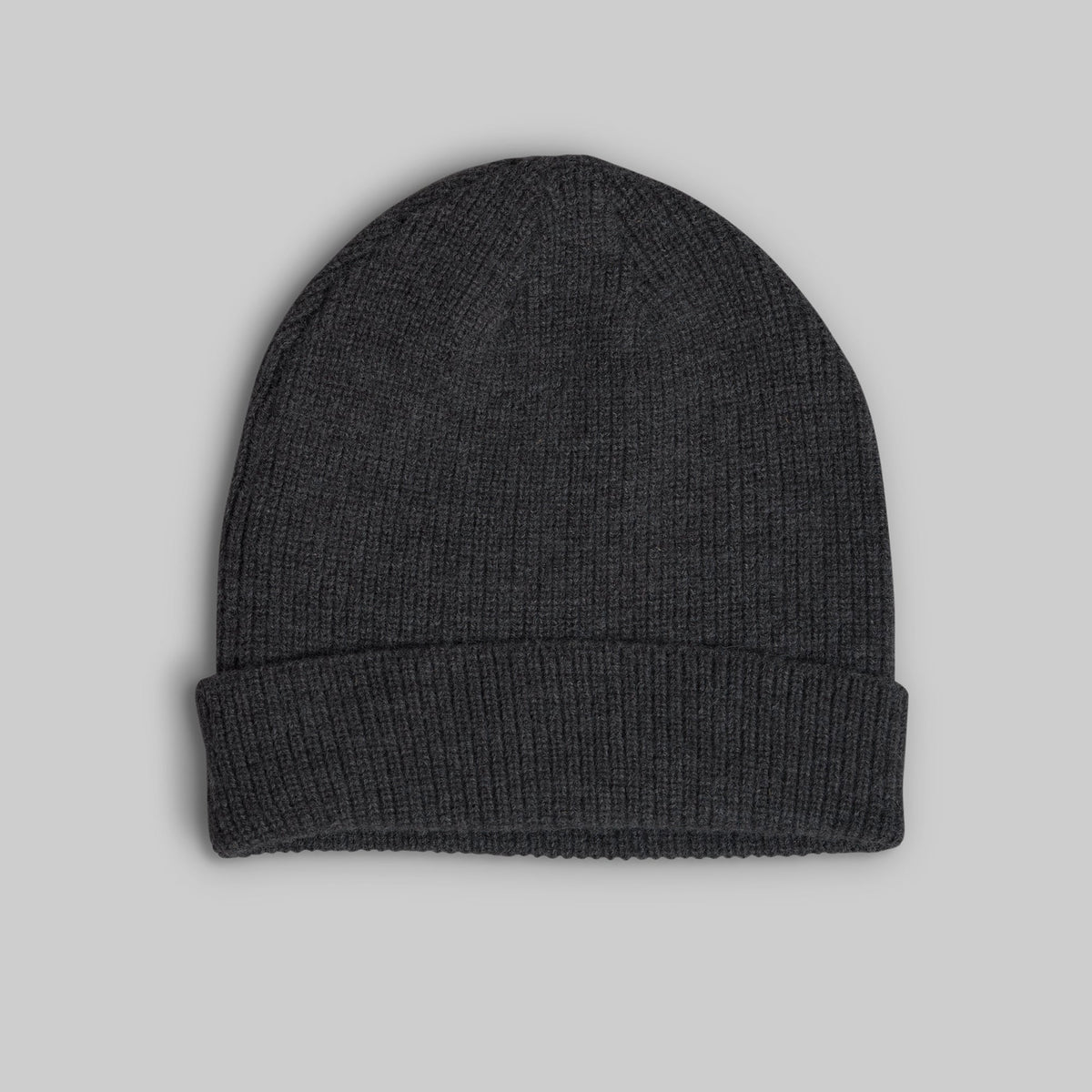 A dark charcoal gray ribbed knit beanie hat with a folded cuff, shown flat against a solid light gray background.