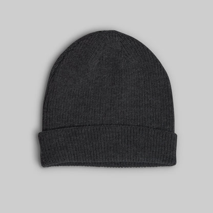 A dark charcoal gray ribbed knit beanie hat with a folded cuff, shown flat against a solid light gray background.