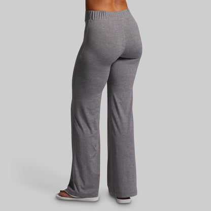 Gray sweatpants worn by a person on a light gray background