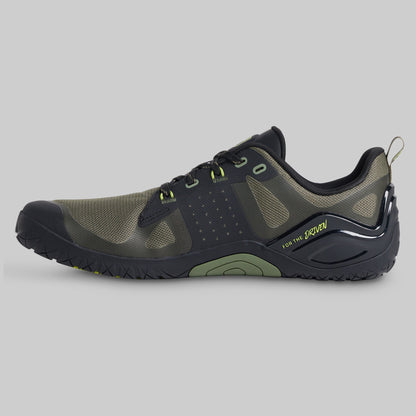 Green and black athletic shoe shown from the side