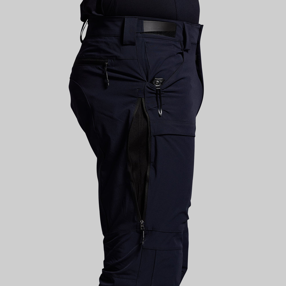 Blue outdoor pants on a gray background