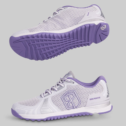 White and purple athletic shoes on a gray background