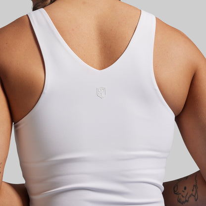 White tank top with a brand logo on a neutral background