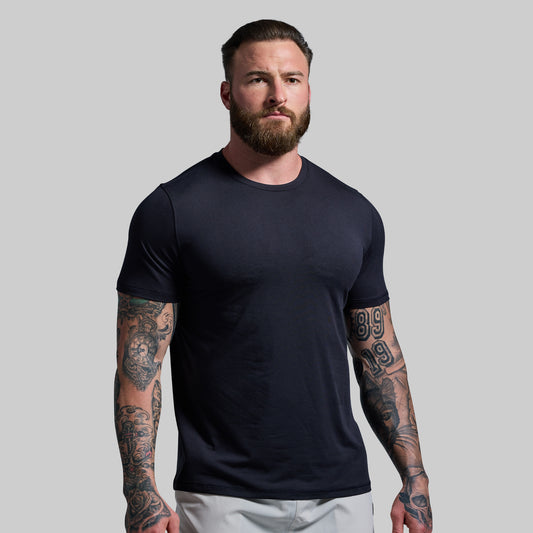 Man wearing a black t-shirt against a plain background