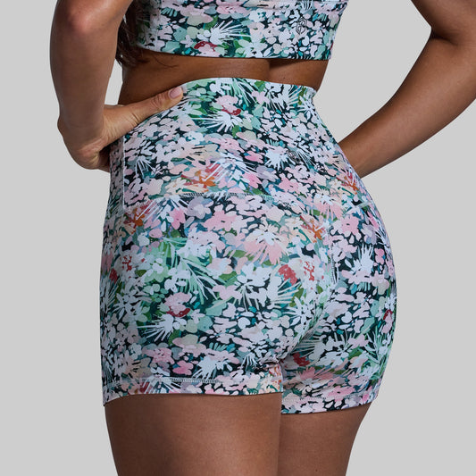 Floral patterned shorts on a plain background