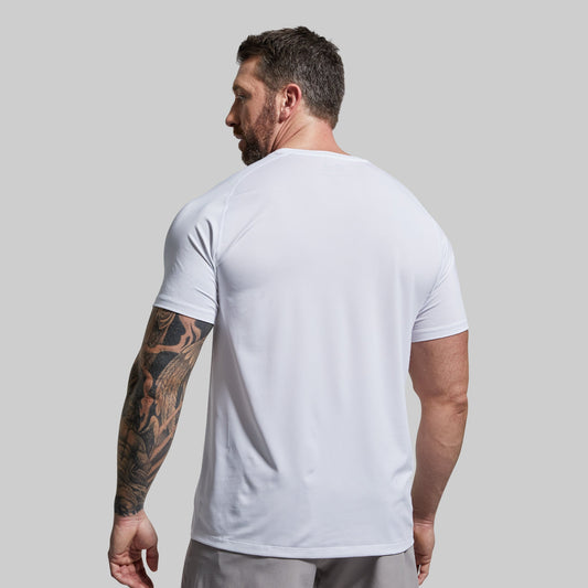 Man wearing a white t-shirt against a plain background