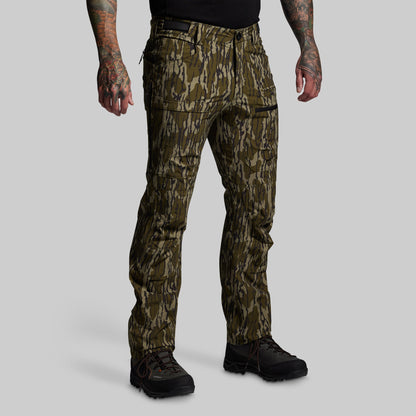 Camouflage pants worn by a person on a gray background
