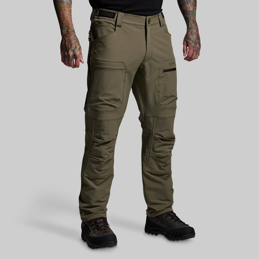 Olive green tactical pants worn by a person on a gray background