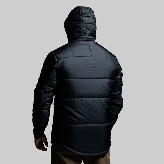 Black puffer jacket with a hood on a gray background