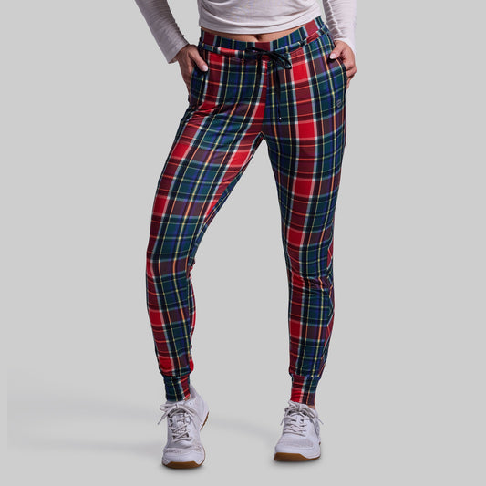 Plaid pants worn by a person on a gray background