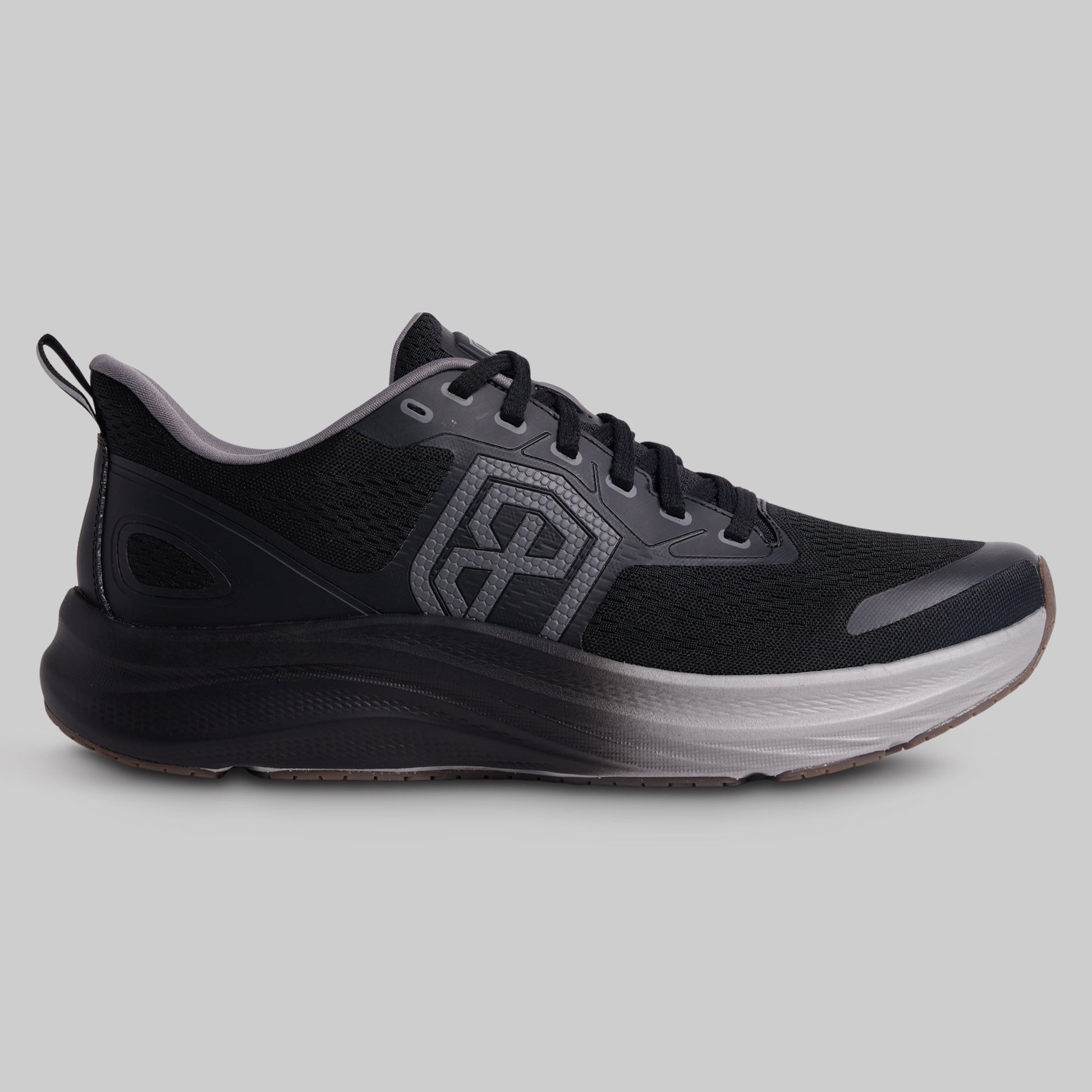 Black running shoe with a visible brand logo on a gray background