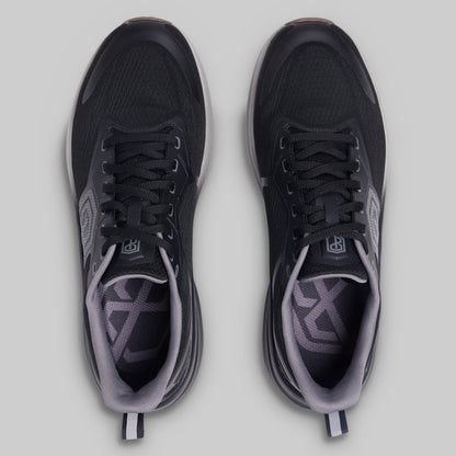 Black and gray athletic shoes on a light gray background