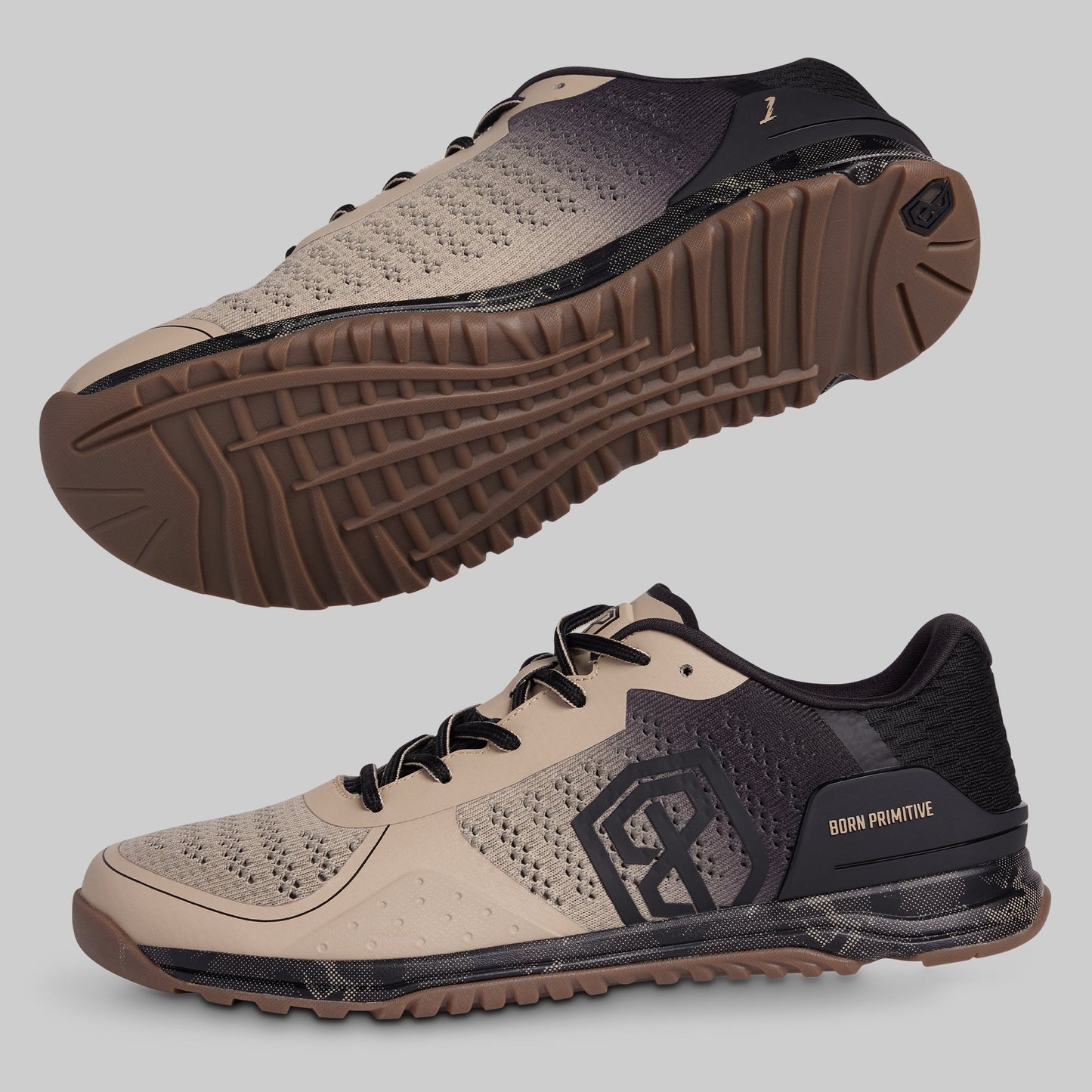 Beige and black athletic shoes with a prominent sole on a gray background